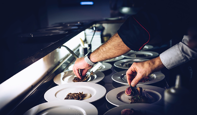sous chef preparing plates
